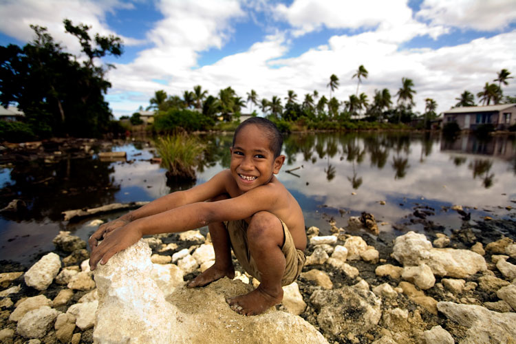Boy playing near a flooded area in Popua Village at the outskirts of Nuku'alofa, the Capital of Tonga. Photo credit: Asian Development Bank, via Flickr