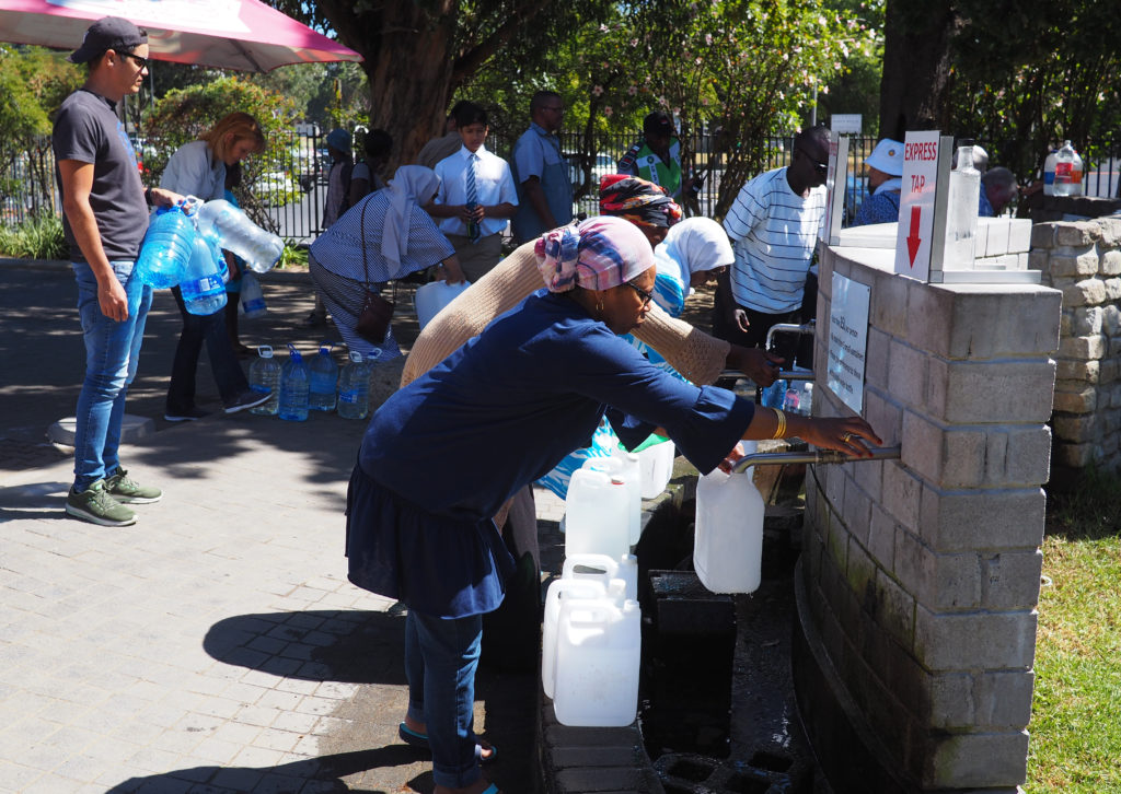 Residents of Cape Town queue for water during the drought. Photo: fivepointsix / Getty Images.