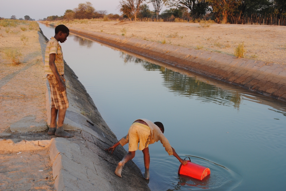 Child fetching water from canal in rural Namibia (Photo by Irene Kunamwene, ASSAR)