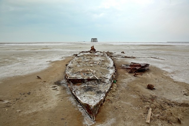 Photo of a wreckage of a boat is seen stuck in solidified salts and sands at Lake Oroumieh. Credit: Ebrahim Noroozi / AP Photo. Source: http://www.thenational.ae/world/middle-east/iran-in-a-race-to-save-largest-lake-from-drying-up