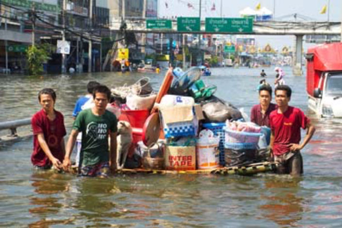 Residents moving their belongings on a raft during the 2011 Thailand floods