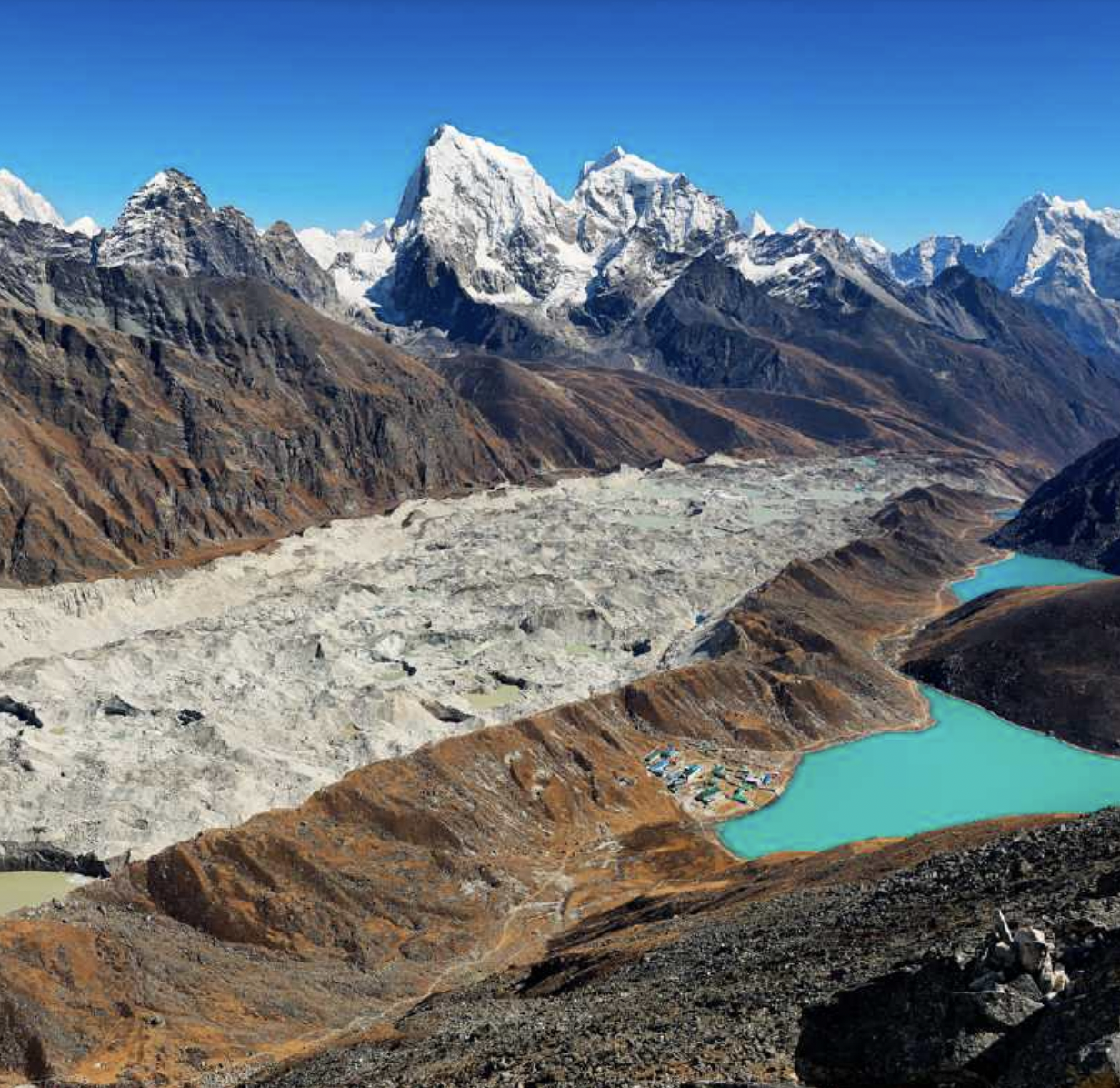 Gokyo Lake, Nepal: a mountain range with a bright turquoise lake in between two peaks