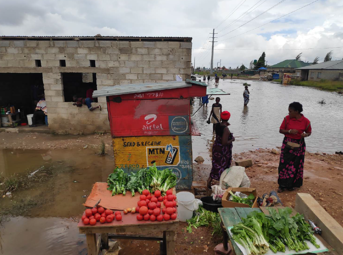 Flood waters near a market stall in Kanyama