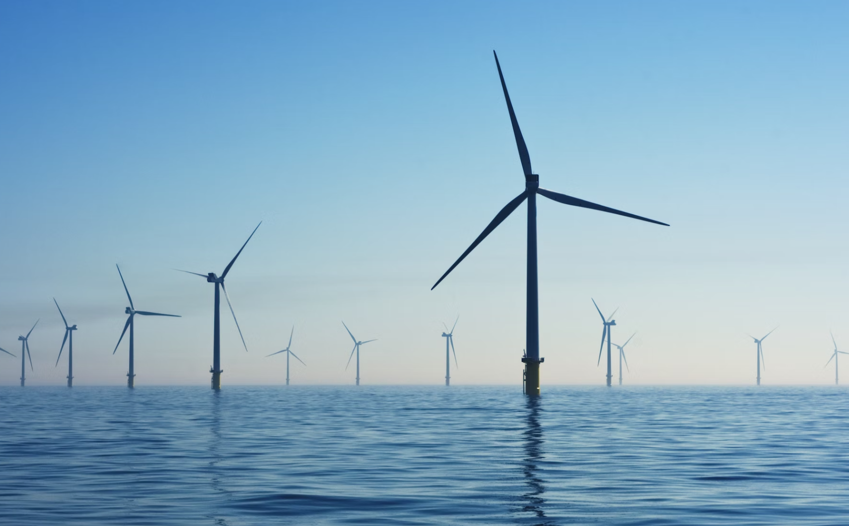 wind turbines in the blue sea with a blue sky background