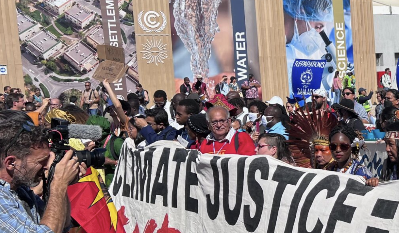 Indigenous Peoples participating in a march at COP27