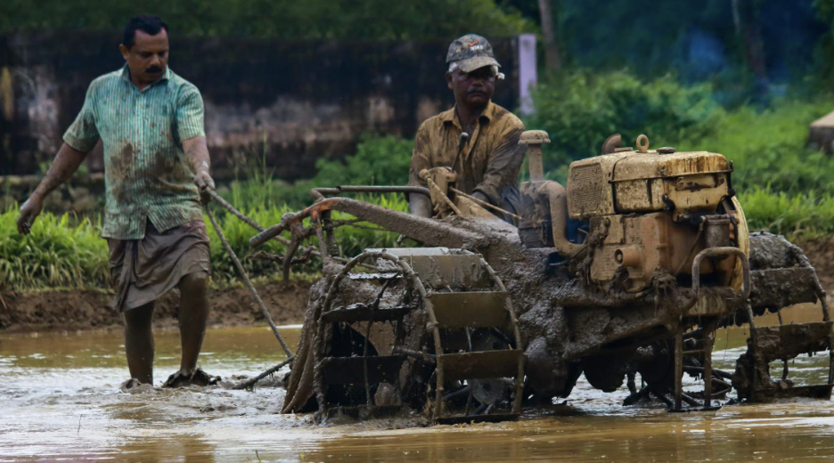 Farmer on tractor in floods
